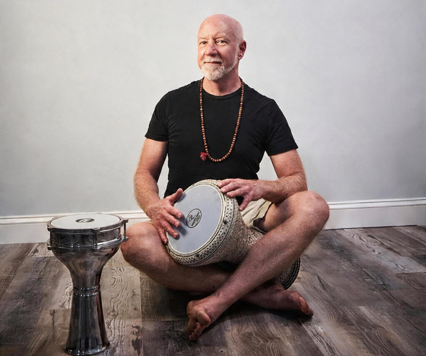Timothy Burgin playing hand drums, Asheville yoga and sound bath teacher