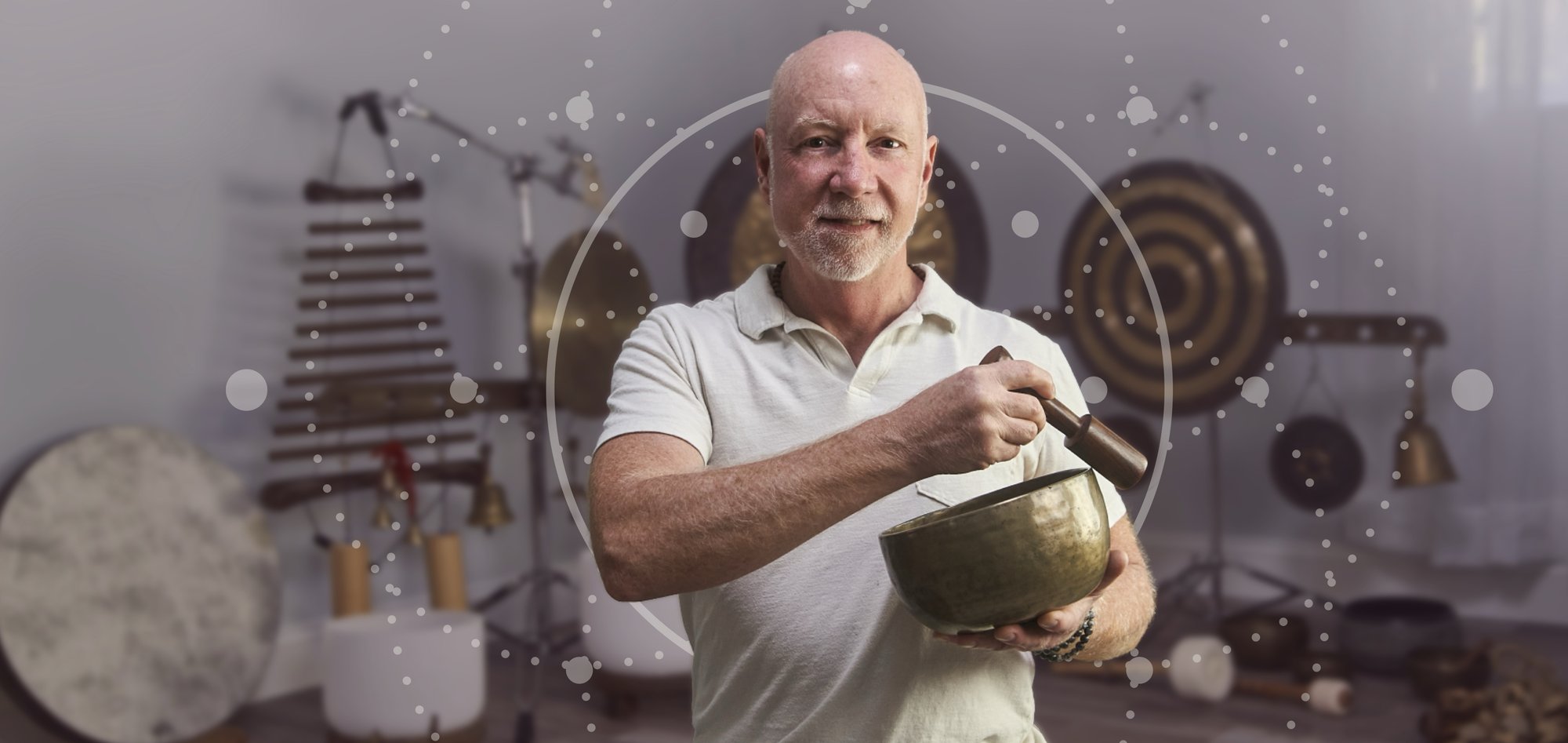 Timothy Burgin playing a singing bowl during a sound bath in Asheville, NC